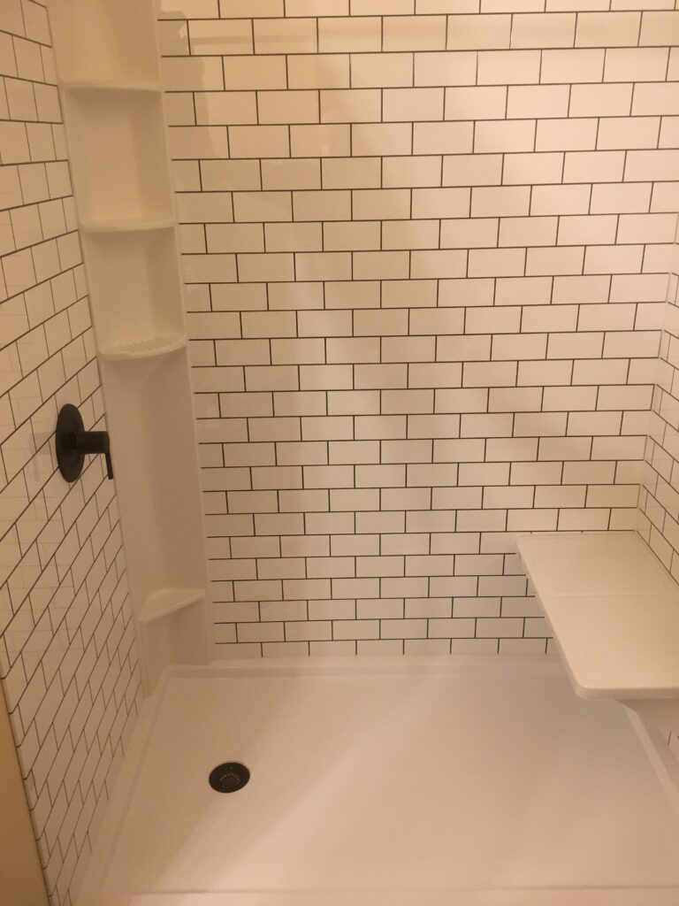 Full bathroom remodel with acrylic bath and surround